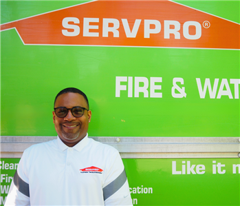 SEVRPRO employee pictured in front of green background