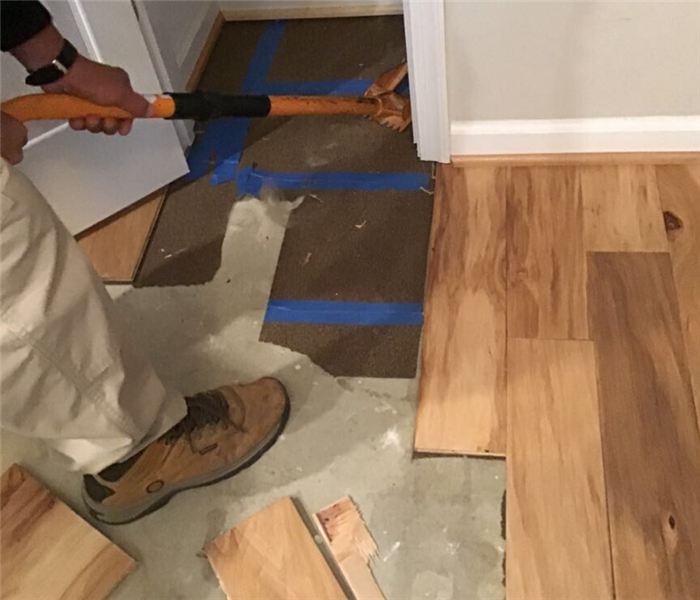 man removing wood floor