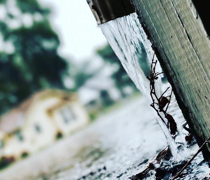 rain water coming out of gutter